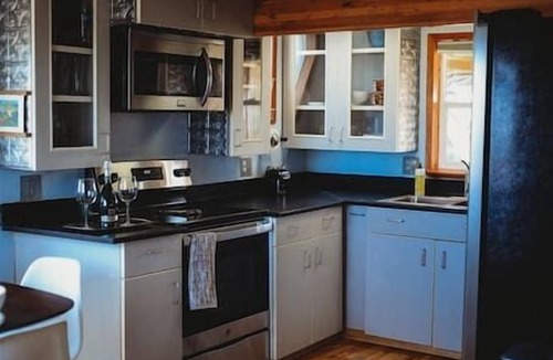 Fairbanks Ski Chalet | This A-frame is surrounded by mountain ranges that you can enjoy from the many windows