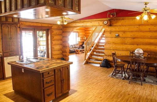 Swift Current House | Three level Log Home on Private 40 Acre Estate.