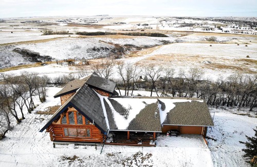 Swift Current House | Three level Log Home on Private 40 Acre Estate.
