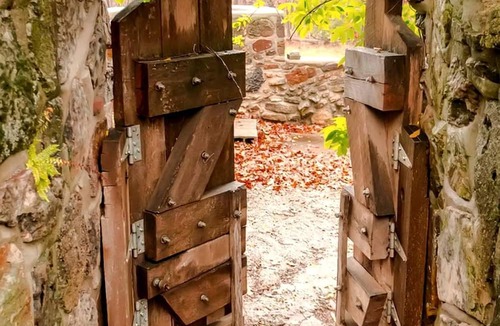 Omaha Cottage | Tranquil Stone Cottage Behind Castle Walls in the Ozarks