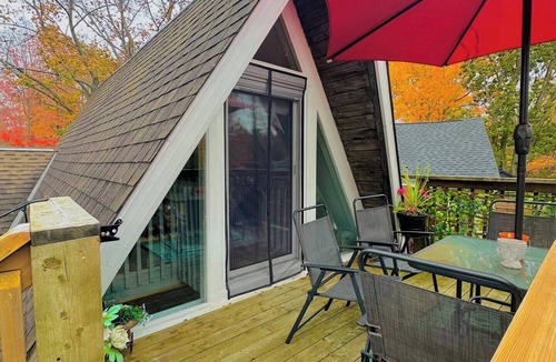 Plympton-Wyoming Cottage | Unique A-frame retreat right on the river and steps to the beach.