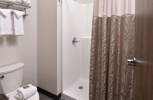 Broken Arrow Hotel | Unwind in Style: Spacious Suites & Relaxing Poolside Retreat | 4 Units