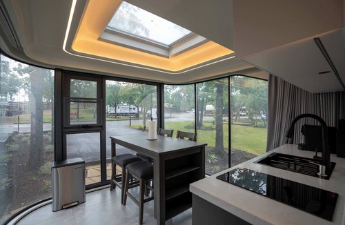 Runaway Bay Apartment | Vessel 8 - Lakefront Vessel Living | Modern Touches Grill Nature Views