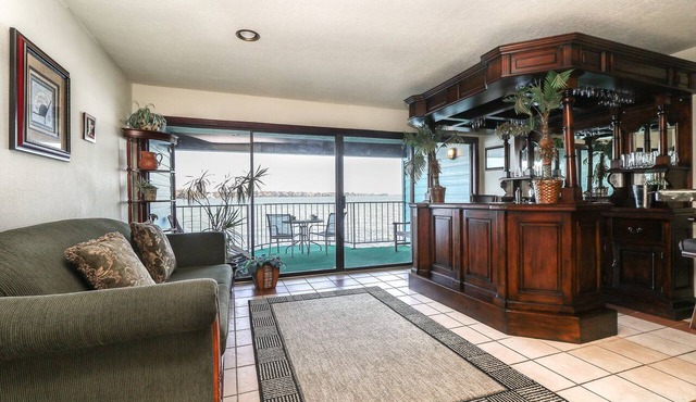 1 Bedroom with a Private Waterfront Balcony and a One-of-a-Kind Bar