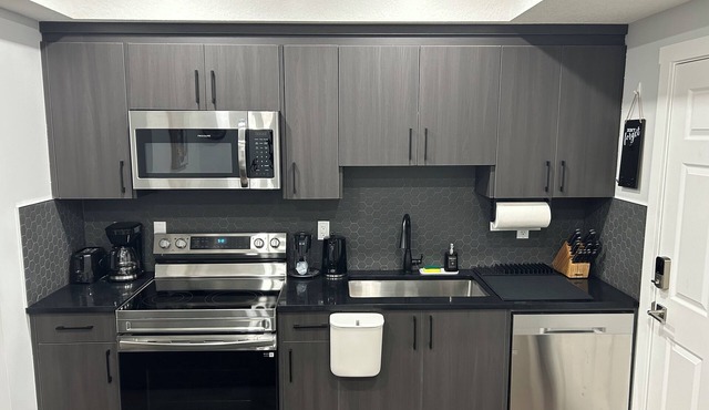 Charming 1-Bedroom Basement Walkout Suite with a Gym and Office.