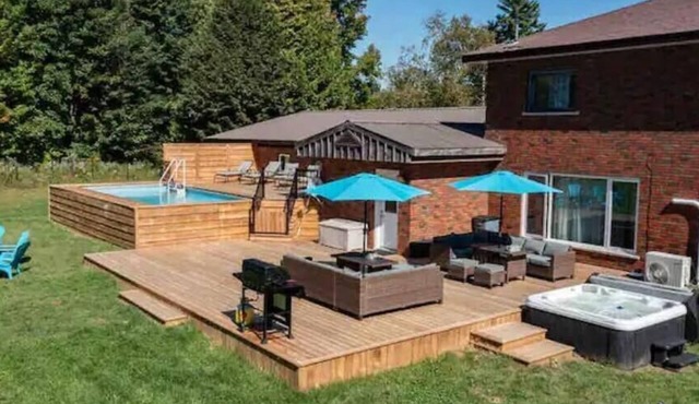 Comfortable cottage for 14 people with pool, hot tub, games, and more.