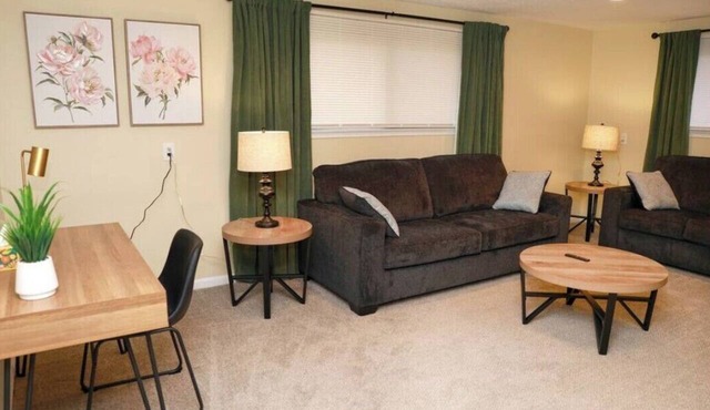 Cozy spacious 4-bedroom home nestled in wooded lot with enclosed porch