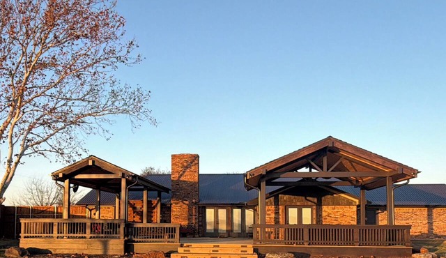Cozy three-bedroom farmhouse with 2 full baths and large covered deck/hot tub.