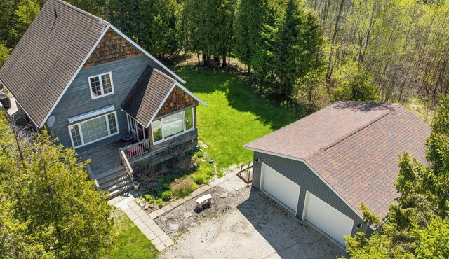 Escape to Three Bears Cottage, a cozy cedar-lined cottage just two blocks from Lake Huron. Enjoy evenings by the fireplace, mornings on the wrap-around porch, and peaceful moments surrounded by nature on the beautiful Bruce Peninsula.
