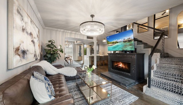 Expansive 2-bed loft with fireplace, full kitchen, smart TVs, sofa bed, and access to an award-winning courtyard & resort pool.