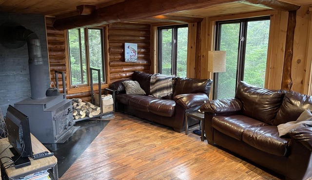 Log cabin in forest in Saint-michel-des-saints