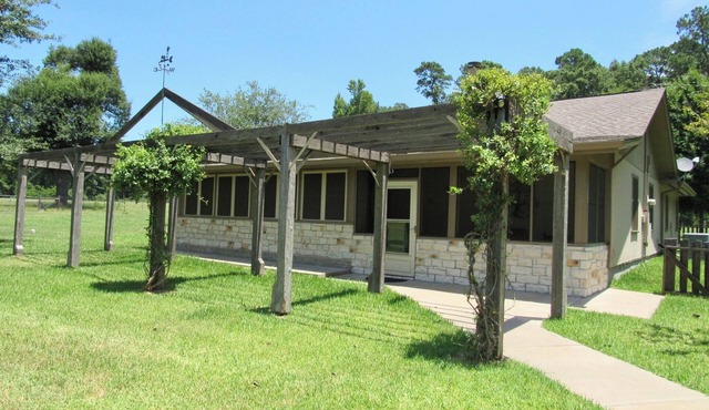 Ranch home situated on 48 acres with a beautiful pond