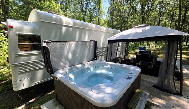 Rustic Converted School Bus with Outdoor Shower Near ORV Trails in Manistee National Forest, Michigan in Bitely