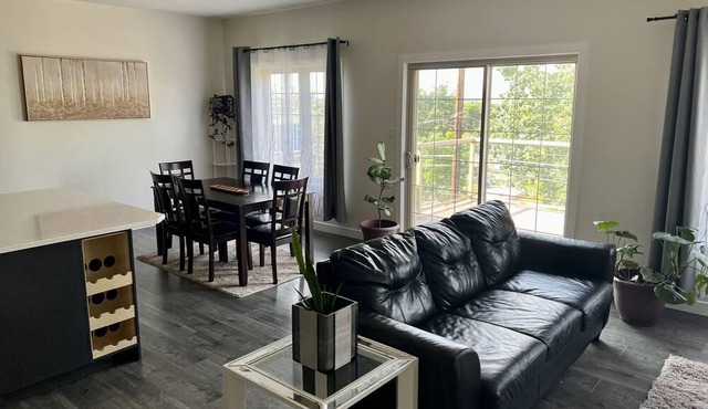 spacious 5 bedroom home with a game room, walk-in basement, and overlooking deck