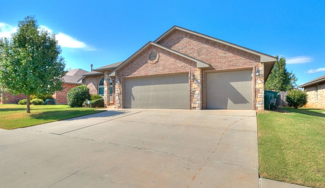 Spacious Edmond Home with Media Room and Fenced Yard