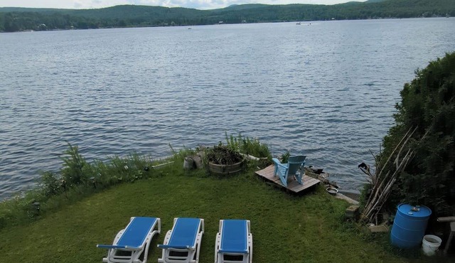 Spectacular Lakehouse with mountain views own sandy beach on crystal clear lake
