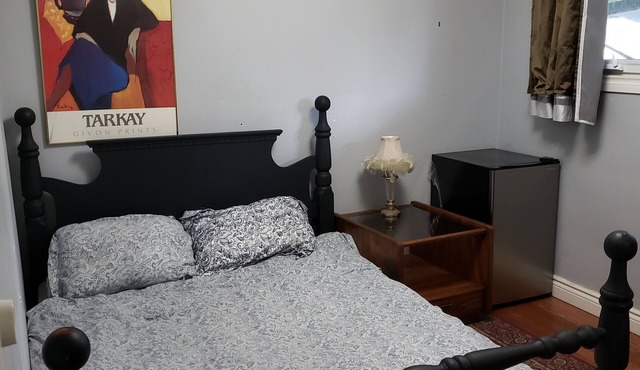Two-storey bungalow near Lake Ontario with shower pool and castle playhouse.