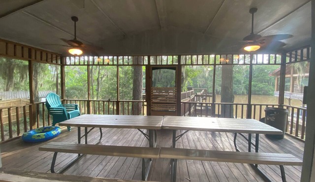 Two Story House with deck over the river